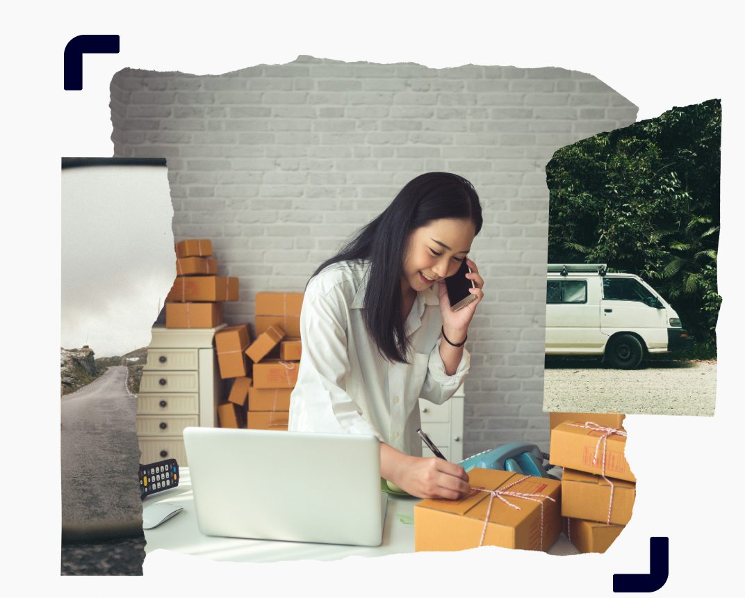 A female business entrepreneur surrounded by packages, talking on the phone